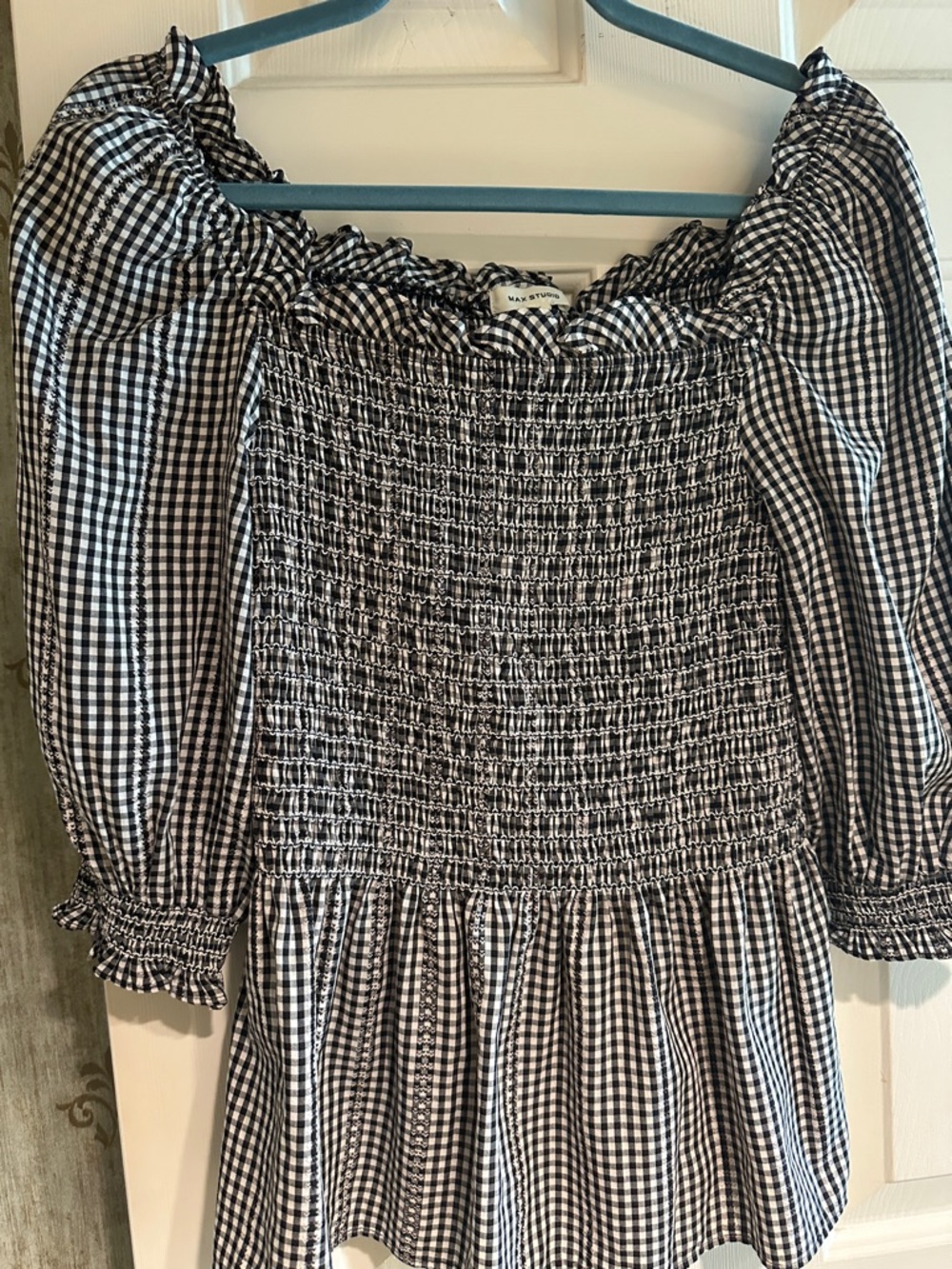 Cute peplum black and white top with shirring.